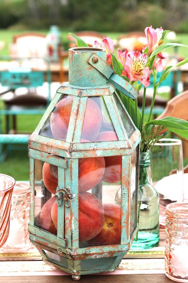 vintage mint lantern with peaches wedding centerpiece