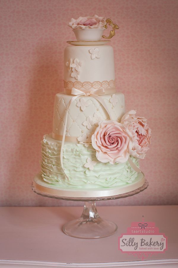 vintage mint wedding cake with pink sugar flowers