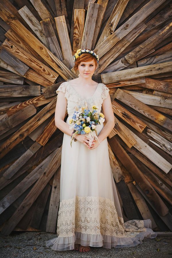 vintage wedding dress and wood pallets wedding backdrop