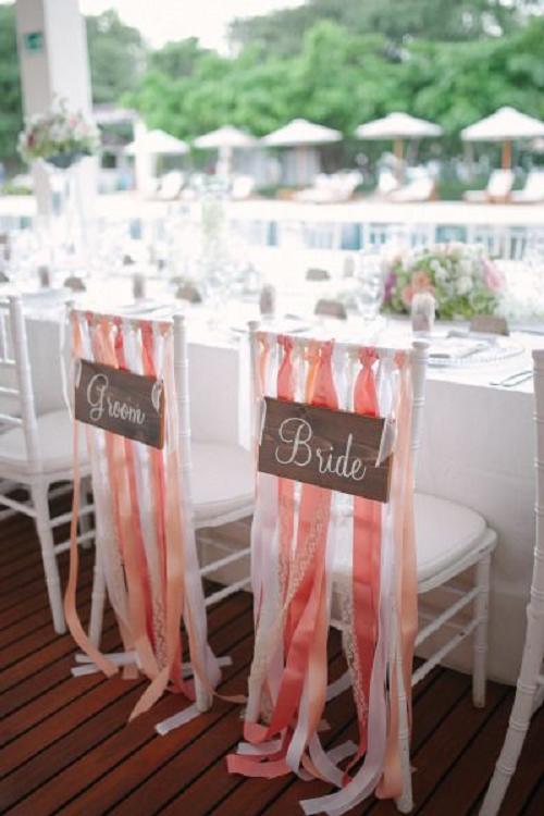 30+ Signage Wedding Chair Decor Ideas We Love 31 white wedding chair with coral ribbons