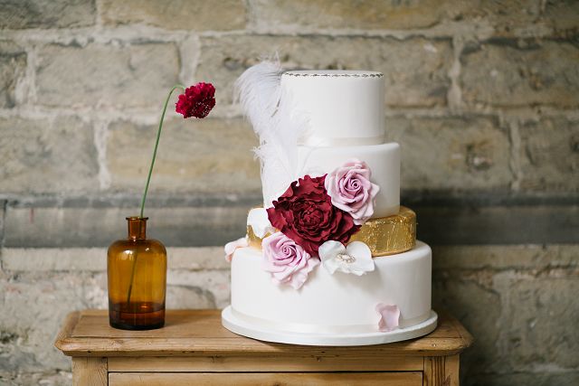 winter white and dark red wedding cake