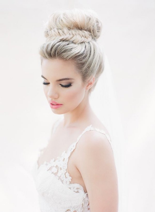 fishtail braided topknot wedding hairstyle and a pink lip