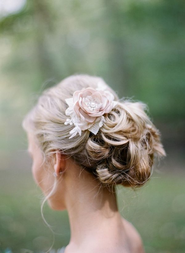 floral pinned wedding updo hairstyle with flowers