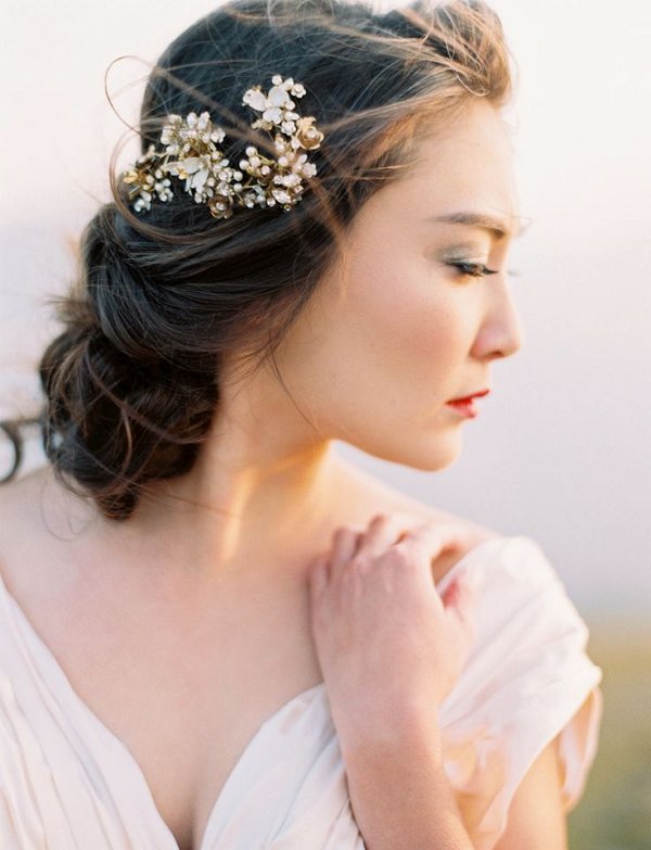 low messy wedding updo hairstyle with hairpiece