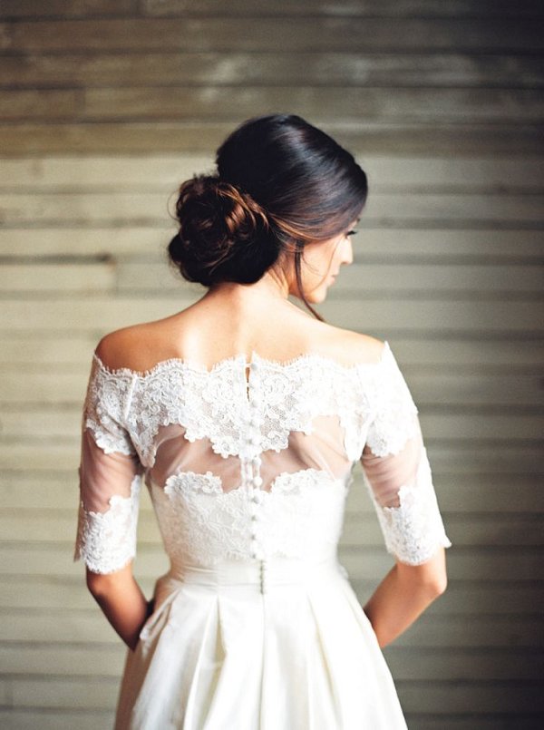 low wedding bown hairstyle and off shoulder wedding dress