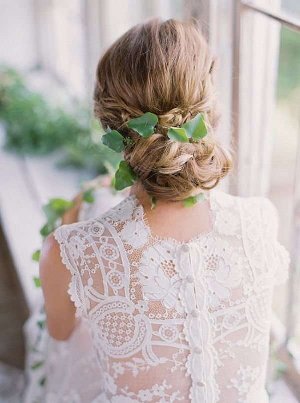 low wedding updo hairstyle with green leaf