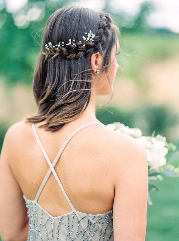 short braided wedding hairstyle with babys breath