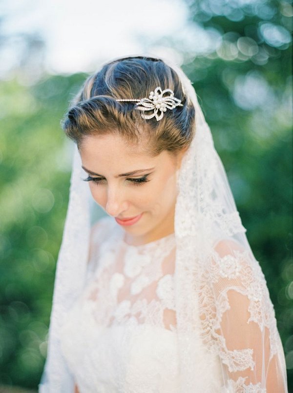 simple wedding updo hairstyle with headpiece and veil