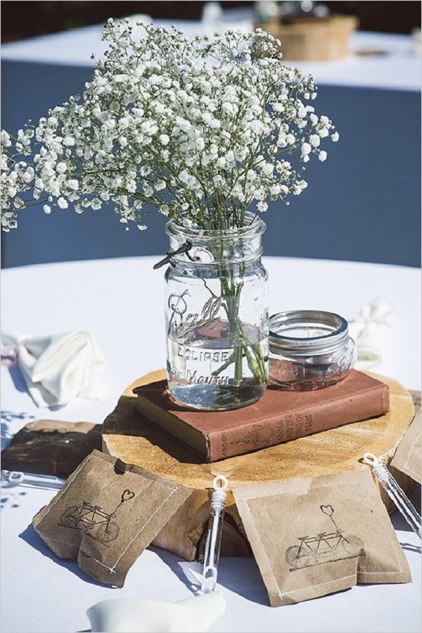Baby's breath and old books wedding centerpieces