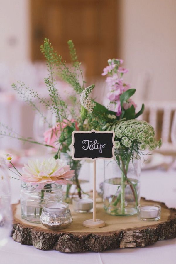 Flowers in mason jars for centrepieces