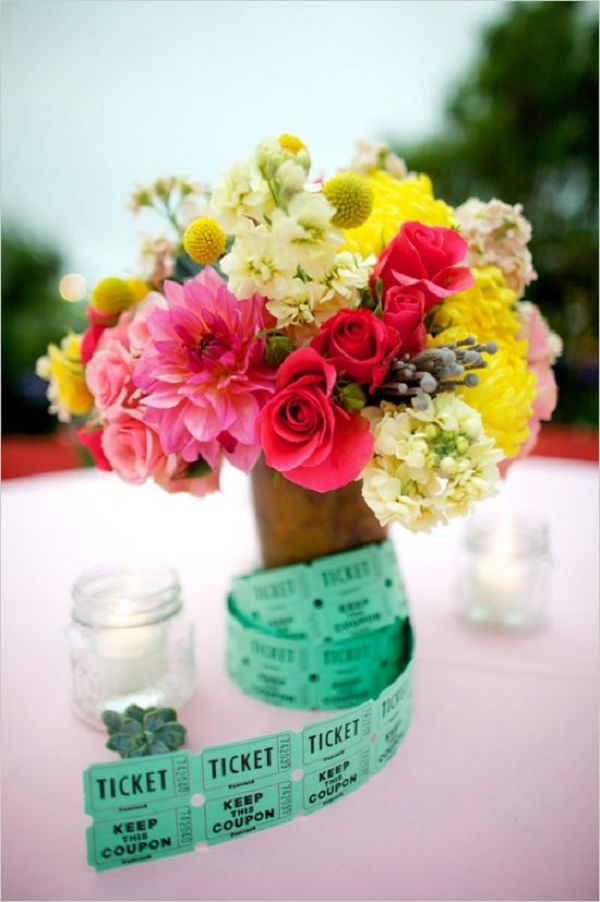 brightly colored florals and carnival ticket centerpiece