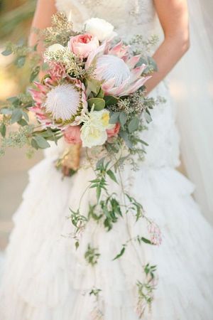 king proteas, clusters of seeded eucalyptus wedding bouquet
