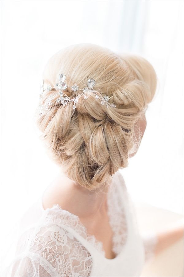 messy low wedding updo with hairpiece