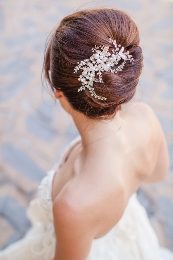 pearl pins glam up an updo bridal hairstyle