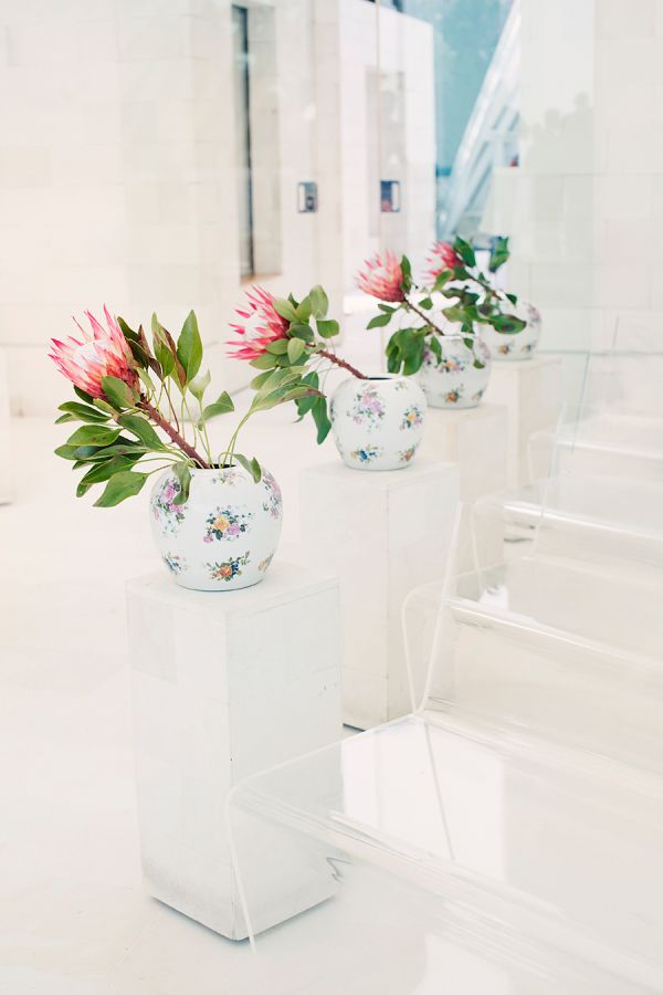 proteas in white chinese vase wedding decor