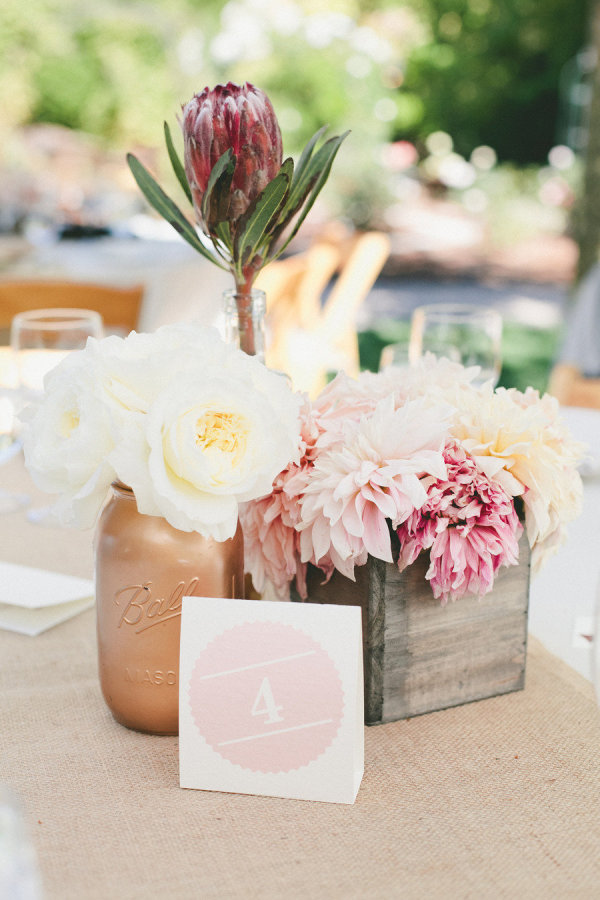 red protea garden roses and dahlia rustic wedding centerpiece