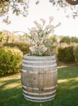 rustic country garden flowers on wine barrel