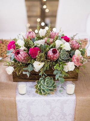 rustic succulent and pink protea with wooden box wedding centerpiece