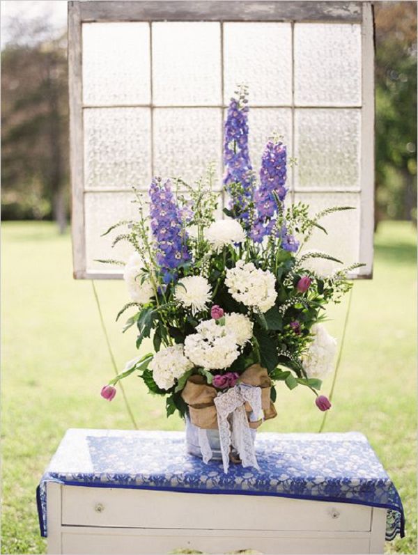 white and purple rustic wedding ceremony floral arrangement ideas