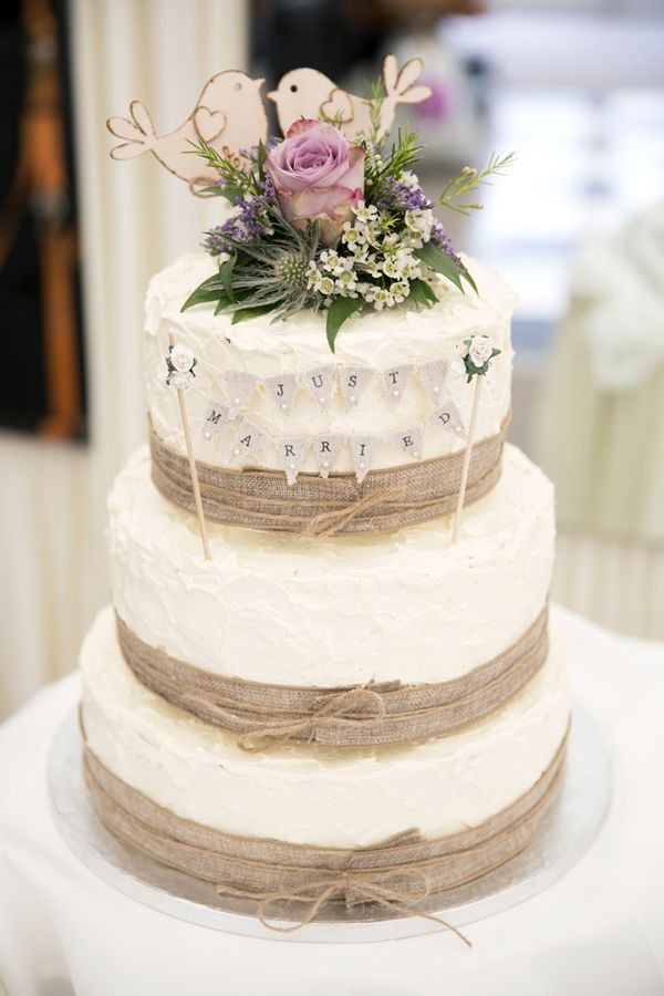Burlap wedding cake with wood lovebirds topper