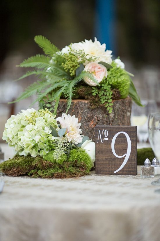 Tree stump moss and floral centerpiece