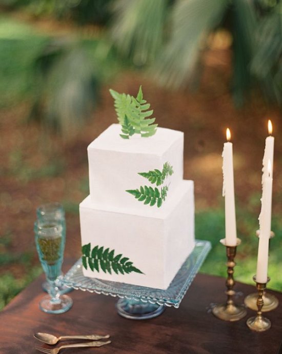 clean white wedding cake with a little bit of the tropics