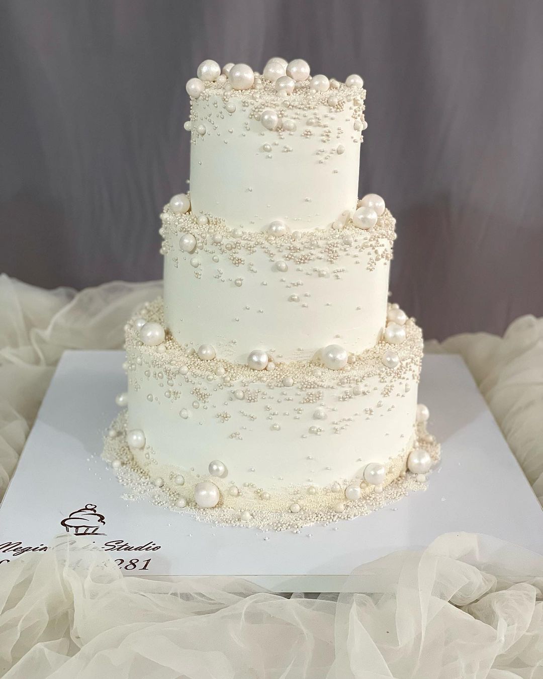 romantic all white pearls wedding cake via negin_cake_studio