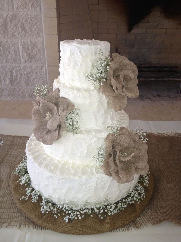 rustic country buttercream wedding cake with burlap flowers