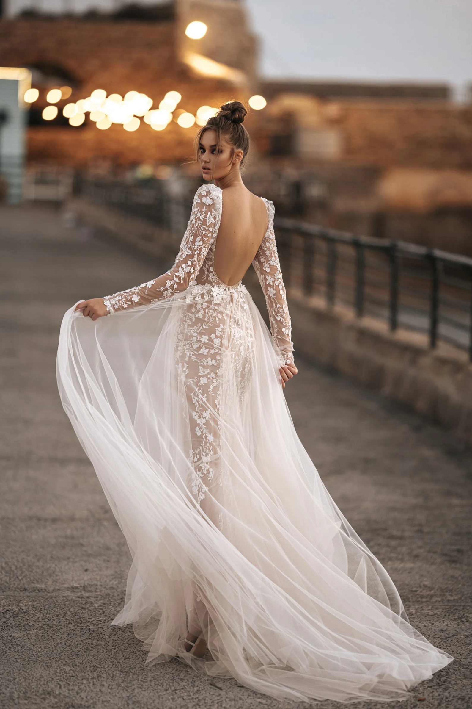 Long sleeves gown with the sheer overskirt and front bow