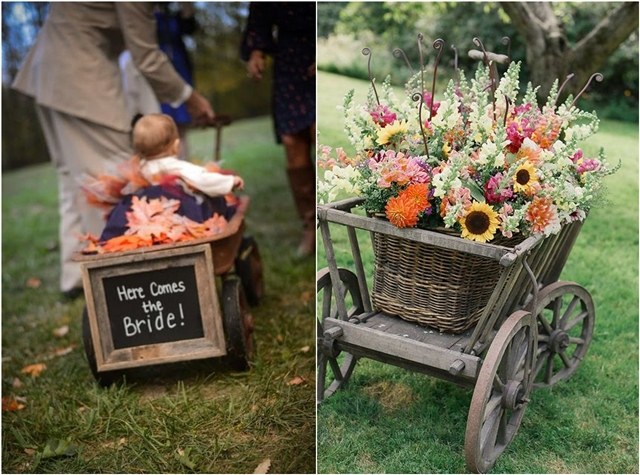 flower girl pulling baby in wagon