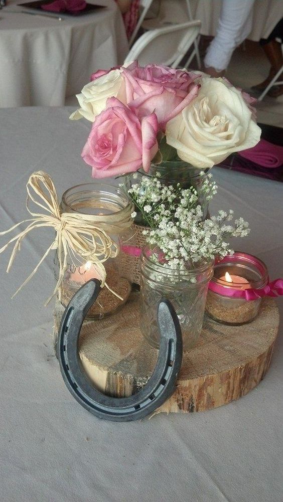 Rustic wedding shower center pieces using all different sizes mason jars