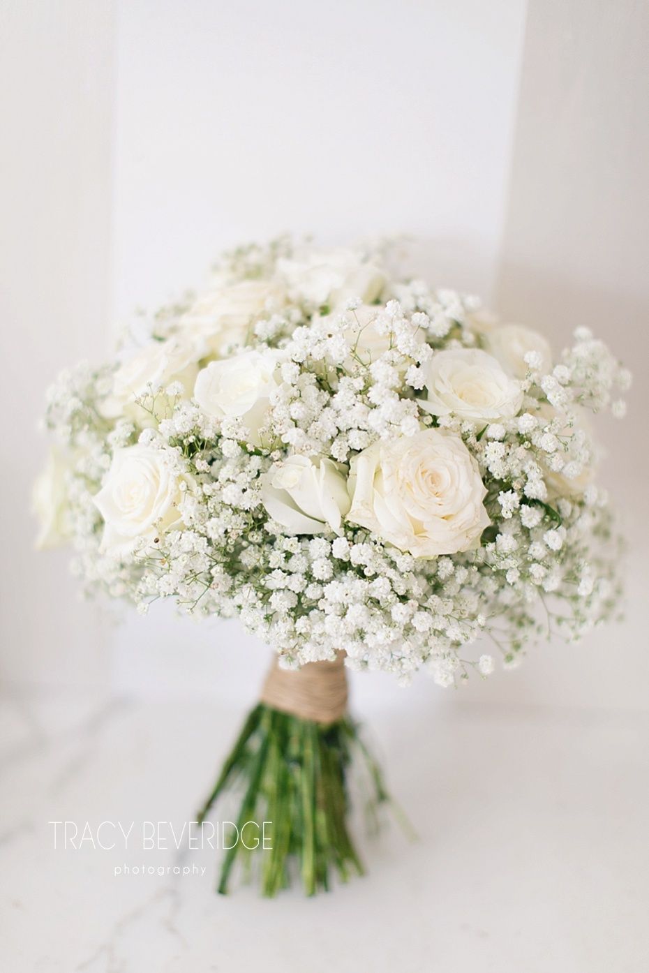 simple white roses and baby's breath round wedding bouquet