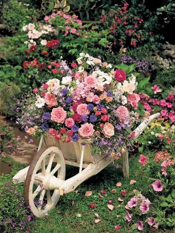 wedding flowers on wheelbarrow