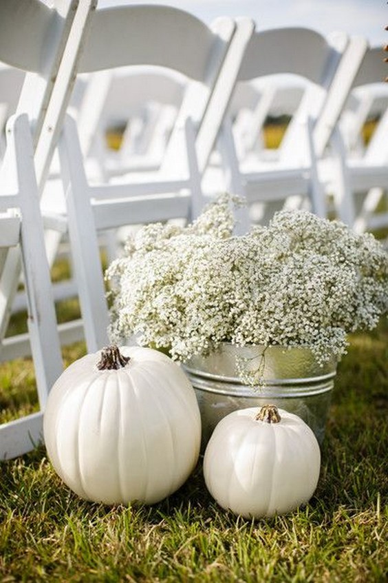 Chic white pumpkins and baby's breath floral arrangement in tin container