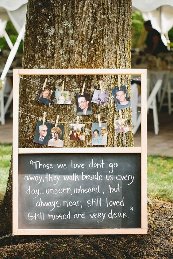 chalkboard wedding signs to honor deceased loved ones at wedding with their photos