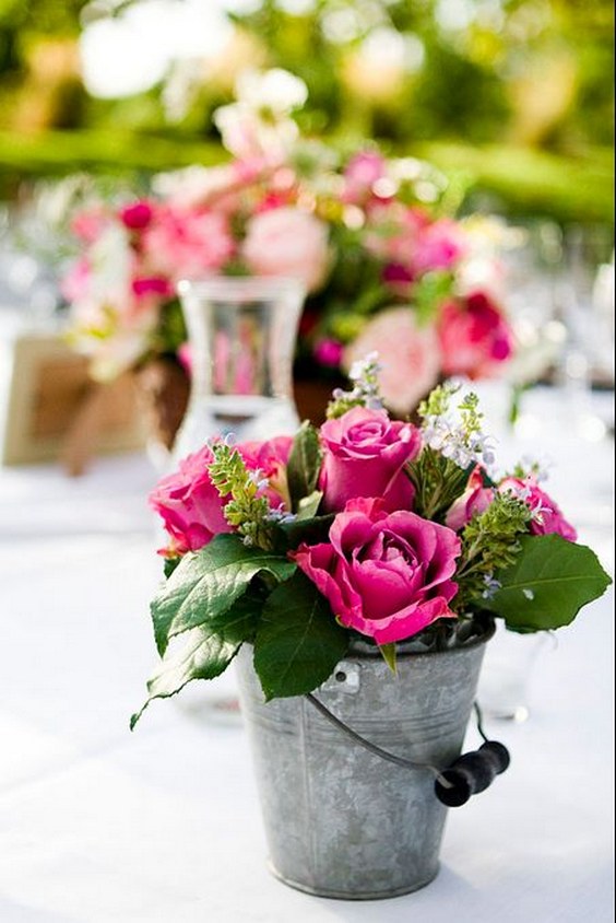 rustic flowers on old bucket wedding centerpiece