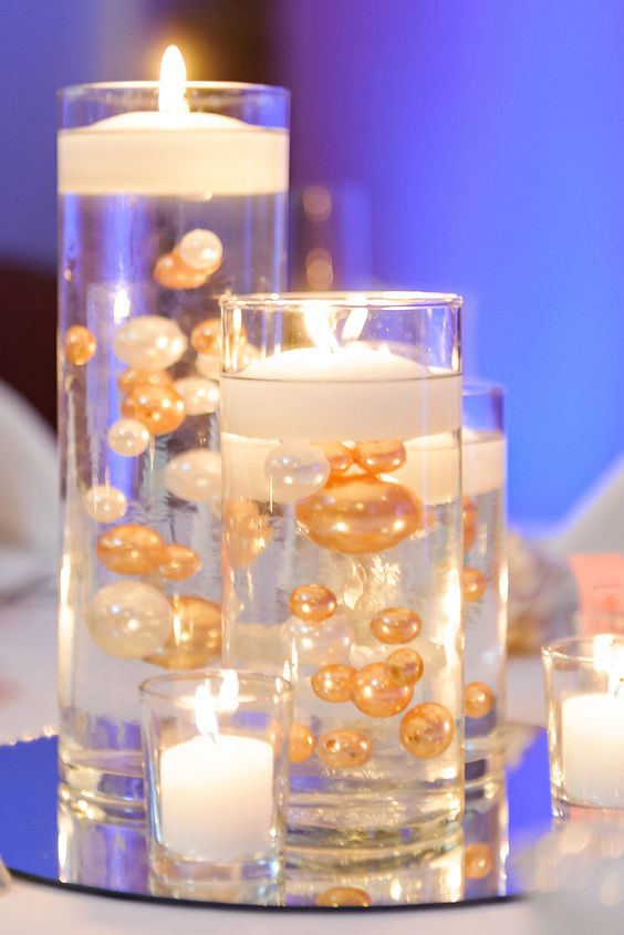 Floating Candle Centerpieces With Gold and White Pearls