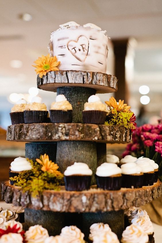 Tree bark cupcake tower with rustic wedding cake tier on top