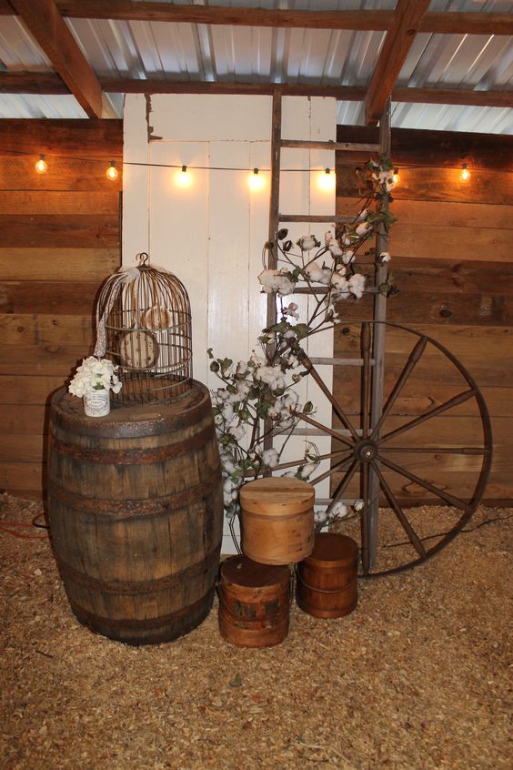 rustic fall wedding decor ideas with wine barrel ladder and wagon wheel