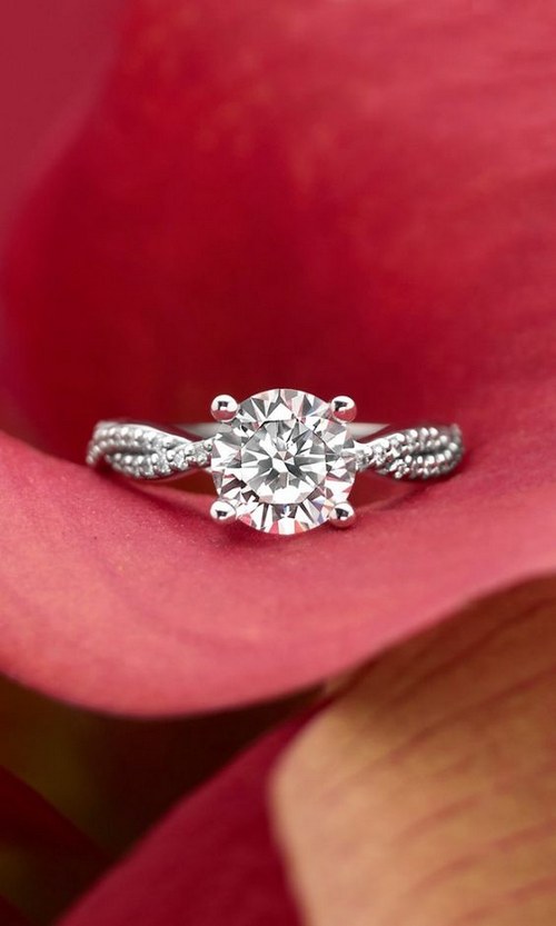 strands of scalloped pavé diamonds twist engagement ring
