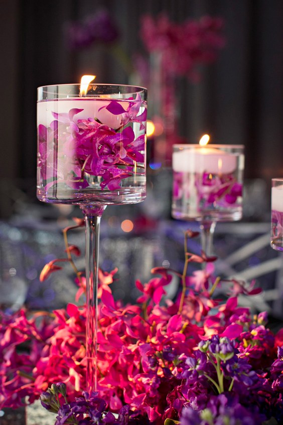 Floating candles and flowers in the water wedding centerpiece