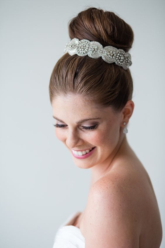 Glam bridal topknot wedding hairstyle via Melissa Robotti
