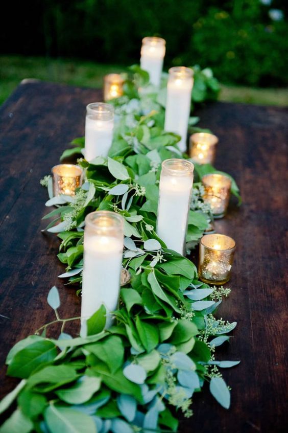 Greenery and candles wedding centerpiece