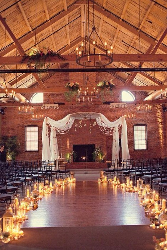 Lining the aisle with a mixture of votives, hurricane vases & lanterns will add a soft glow to a ceremony space.