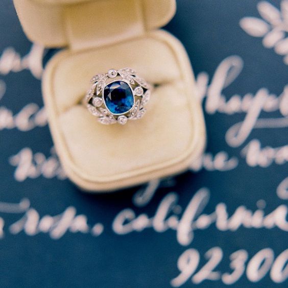 Magnificent Edwardian Era Engagement Ring with Stunning Sapphire and Diamond Laurel Wreath Frame