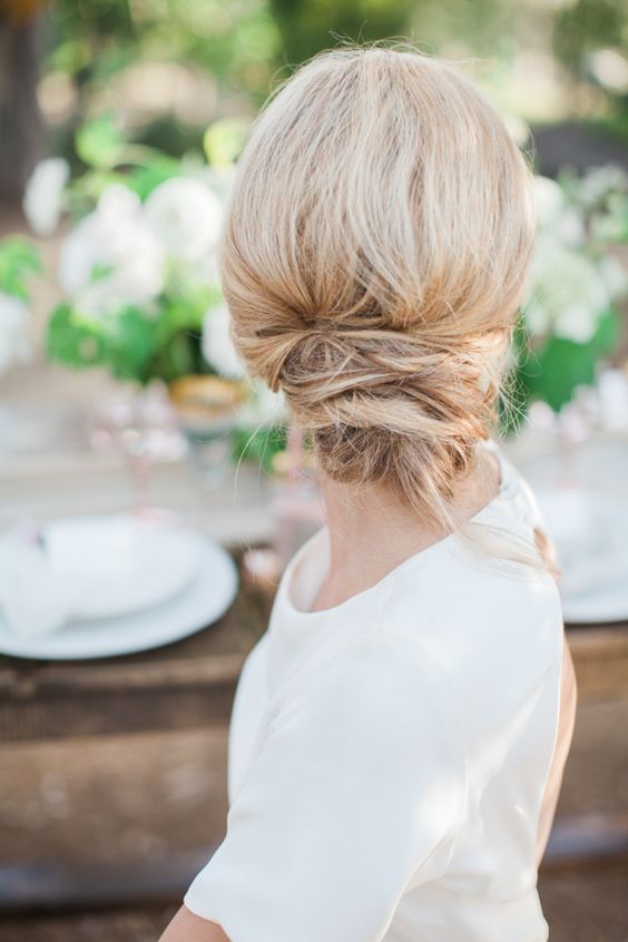 Messy summer chignon wedding hairstyle via Natalie Bray