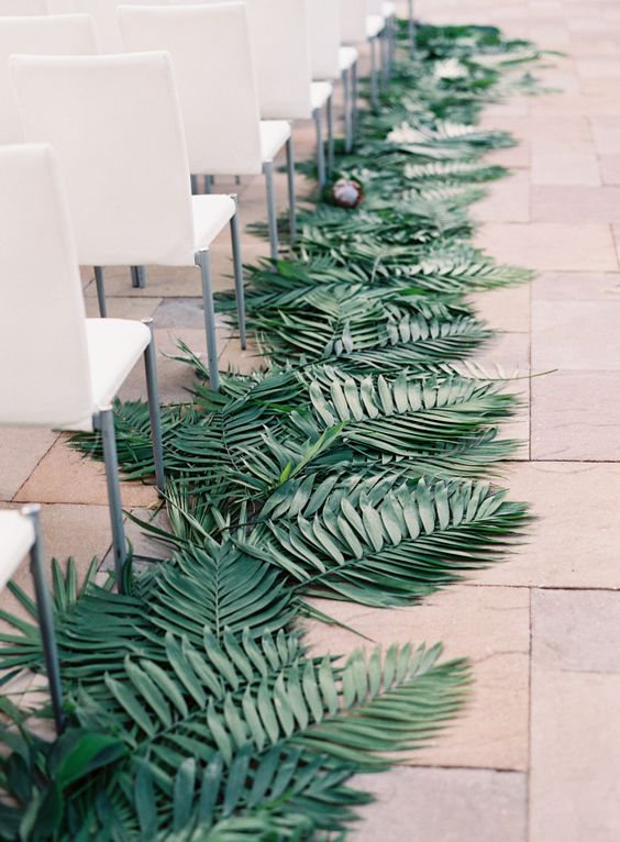 Palm leaf lined aisle