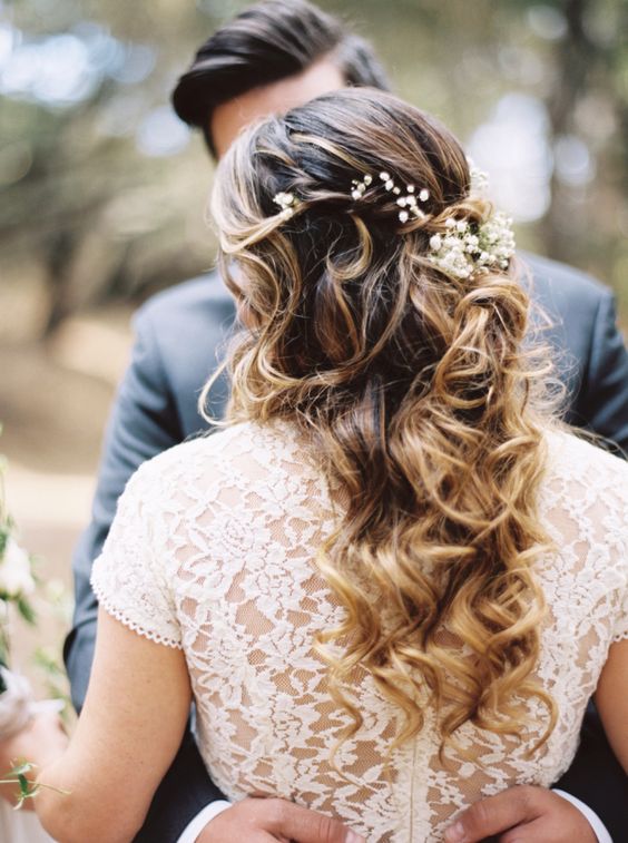 Pretty floral accented wedding hairstyle