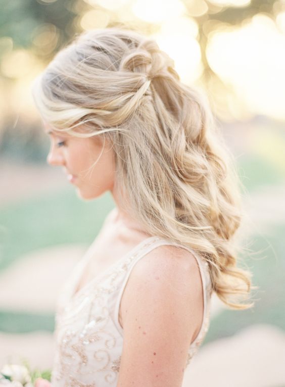 Romantic pinned back wedding hairstyle via Emily Scott