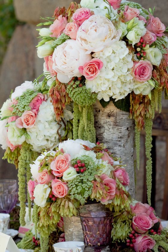 Roses, peonies, hydrangeas in birch vases